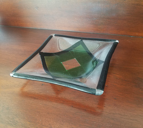 A beautiful hand-crafted decorative glass plate with a green diamond design.  Dimensions: 5-3/4