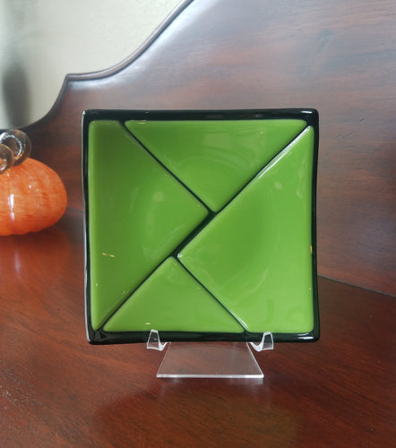 This beautiful hand-crafted green on black decorative glass plate has a design of triangular pieces. Dimensions: 5-3/4