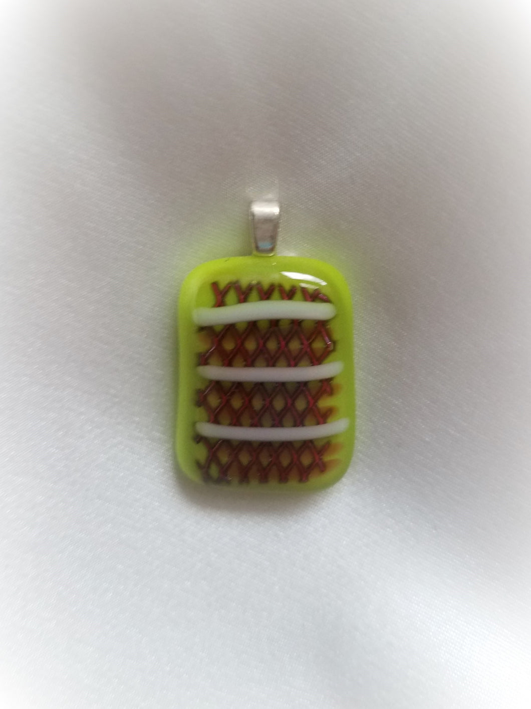 Beautiful pattern on a lime green glass pendant