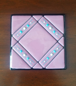 Hand-crafted decorative glass plate, a pretty pink quilt design.  Dimensions: 5-3/4" x 5-3/4" x 1/2"