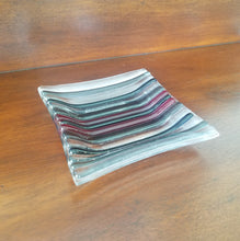 Load image into Gallery viewer, This decorative plate has dark stripes molded with clear glass.
