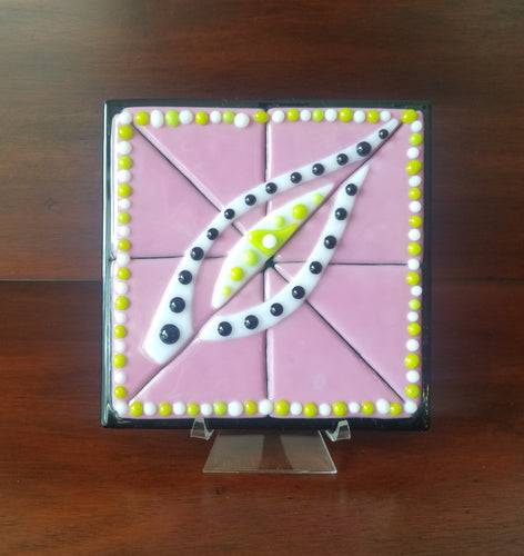Hand-crafted decorative glass plate, a pretty pink background with an interesting eye design.  Dimensions: 5-3/4